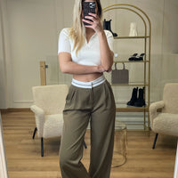 Pantalon à pinces replié